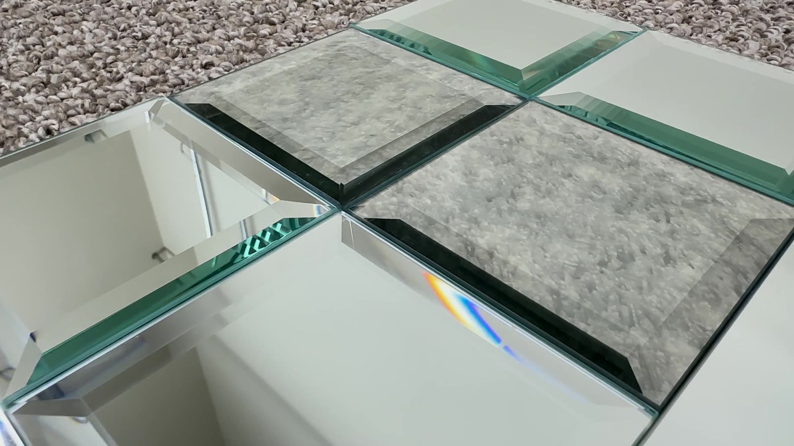 Beveled mirror squares with green glass edges